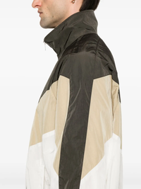 Close up of the brown jacket, showing texture of the polyamide fabric