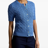 Blue knitwear worn by a person, showing the knitwear fit