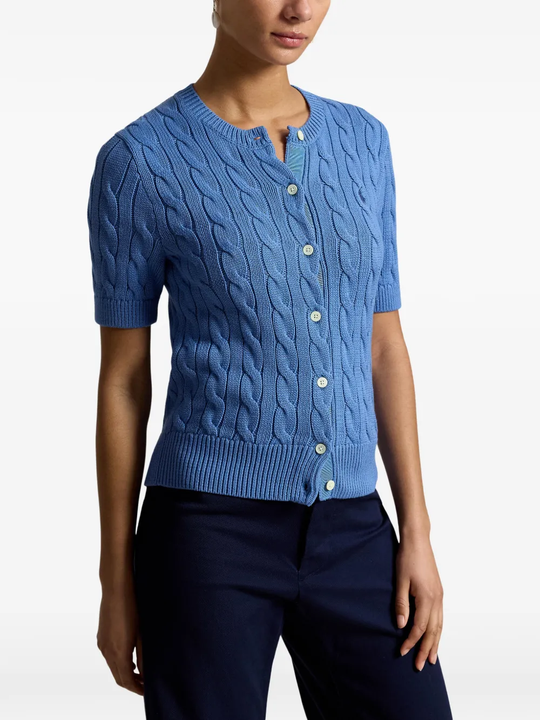 Blue knitwear worn by a person, showing the knitwear fit