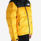 Yellow jacket worn by a person, showing the jacket's fit