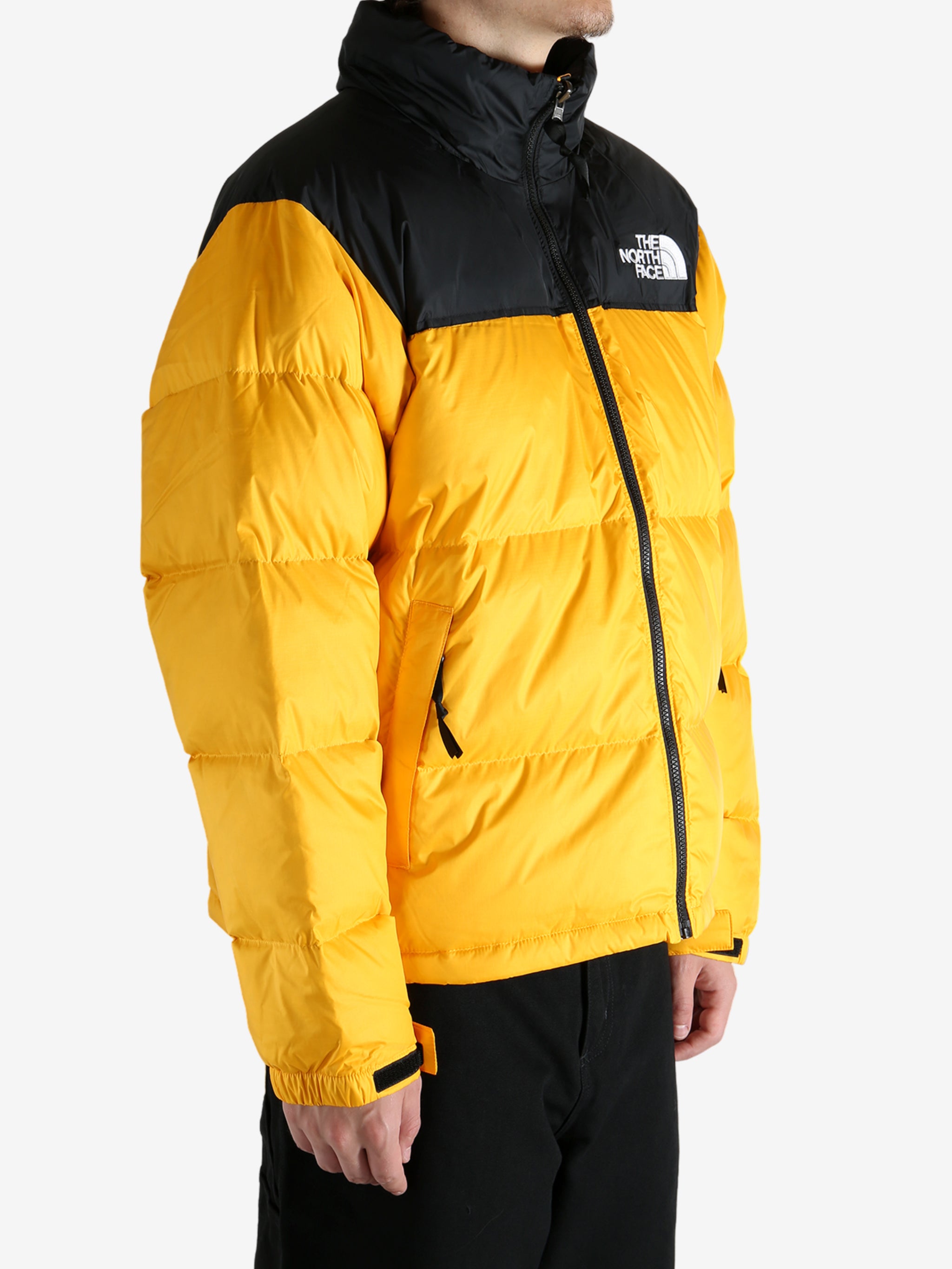 Yellow jacket worn by a person, showing the jacket's fit