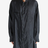 Black shirt worn by a person, showing the shirt's fit