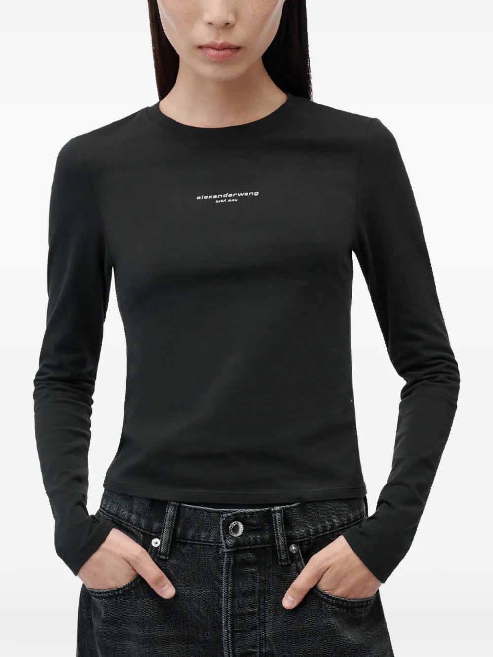 Black t-shirt worn by a person, showing the t-shirt fit