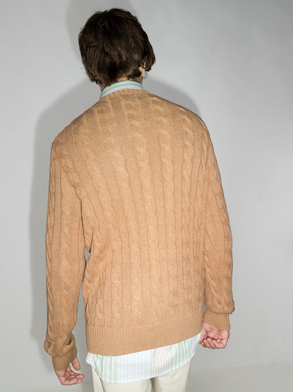 Orange sweater worn by a person, showing the sweater fit