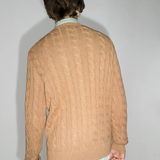 Orange sweater worn by a person, showing the sweater fit