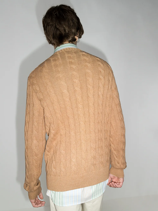 Orange sweater worn by a person, showing the sweater fit