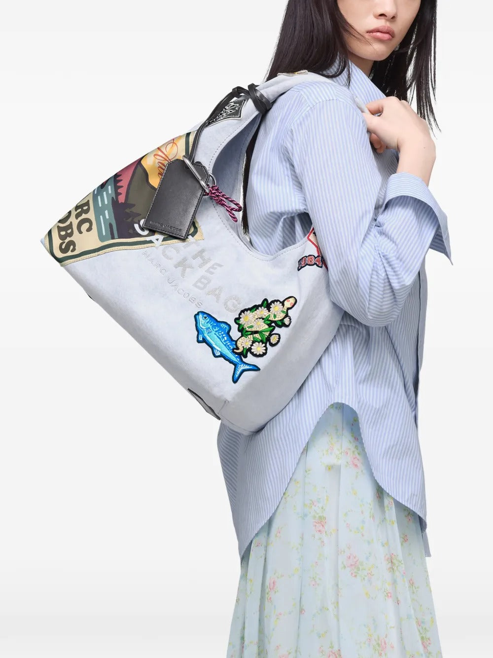 White bag worn by a person, showing the bag fit