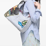 White bag worn by a person, showing the bag fit