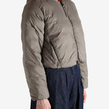 Grey jacket worn by a person, showing the jacket's fit