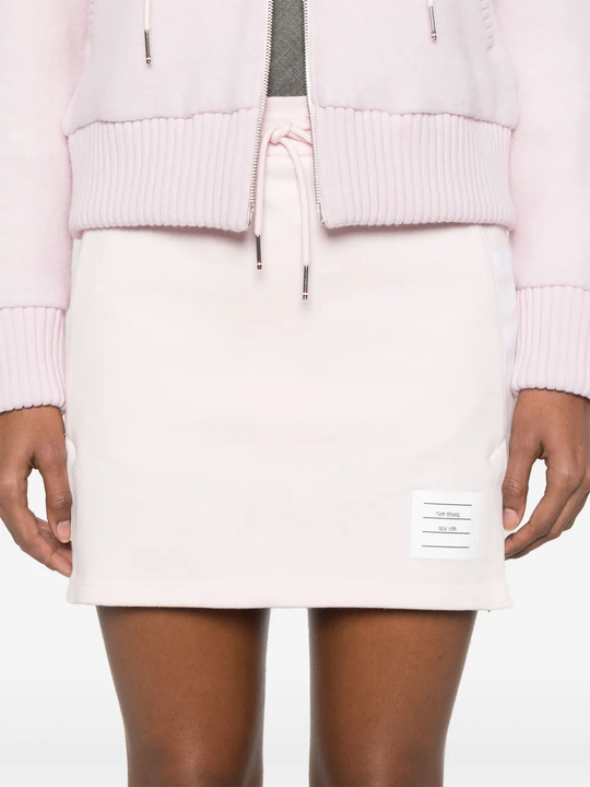 Pink skirt worn by a person, showing the skirt's fit