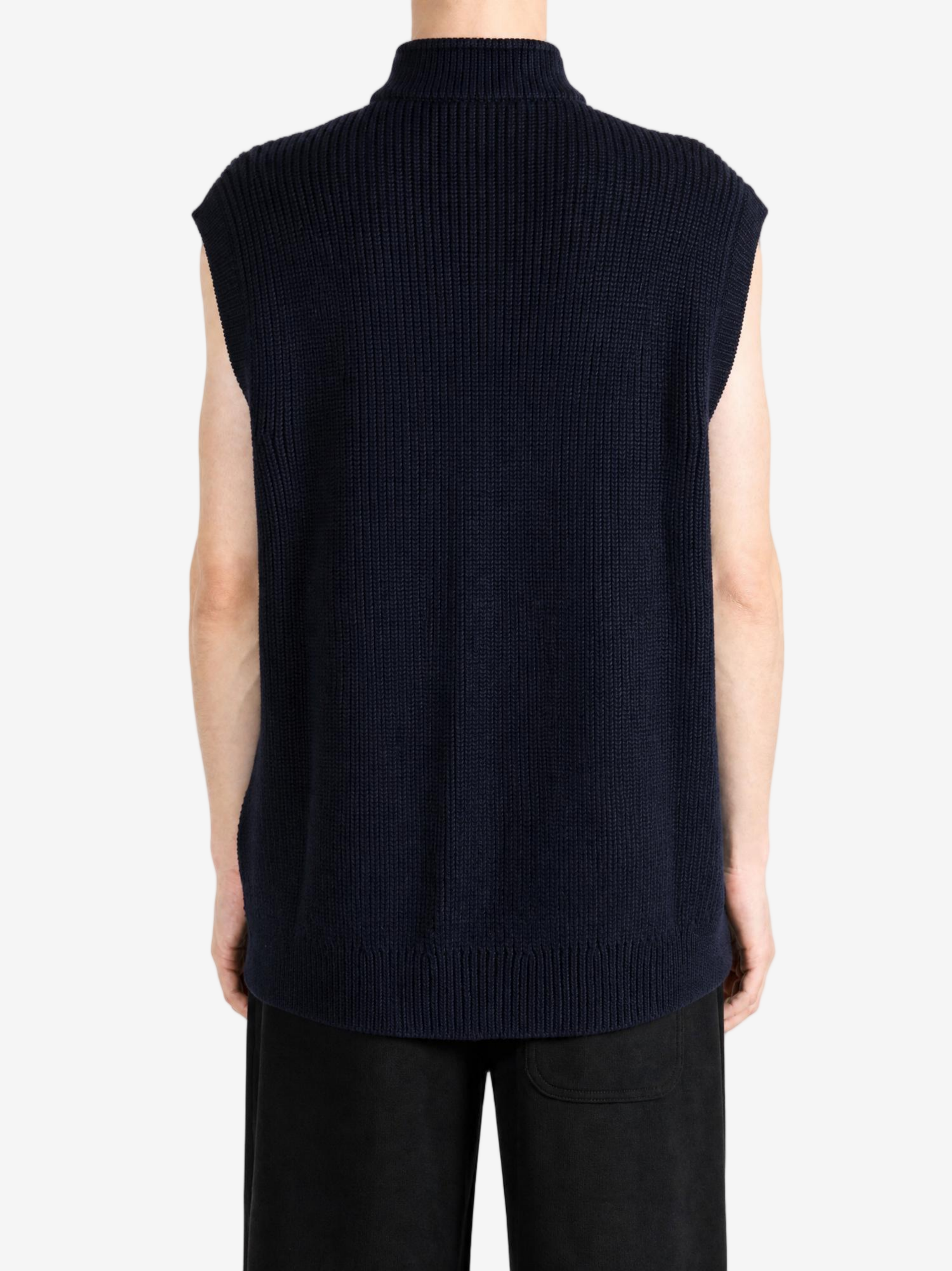 Navy knitwear worn by a person, showing the knitwear fit