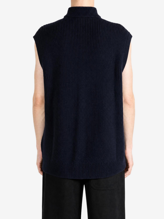 Navy knitwear worn by a person, showing the knitwear fit