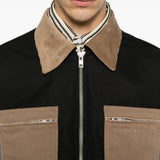 Black jacket worn by a person, showing the jacket fit