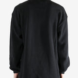 Black t-shirt worn by a person, showing the t-shirt's fit