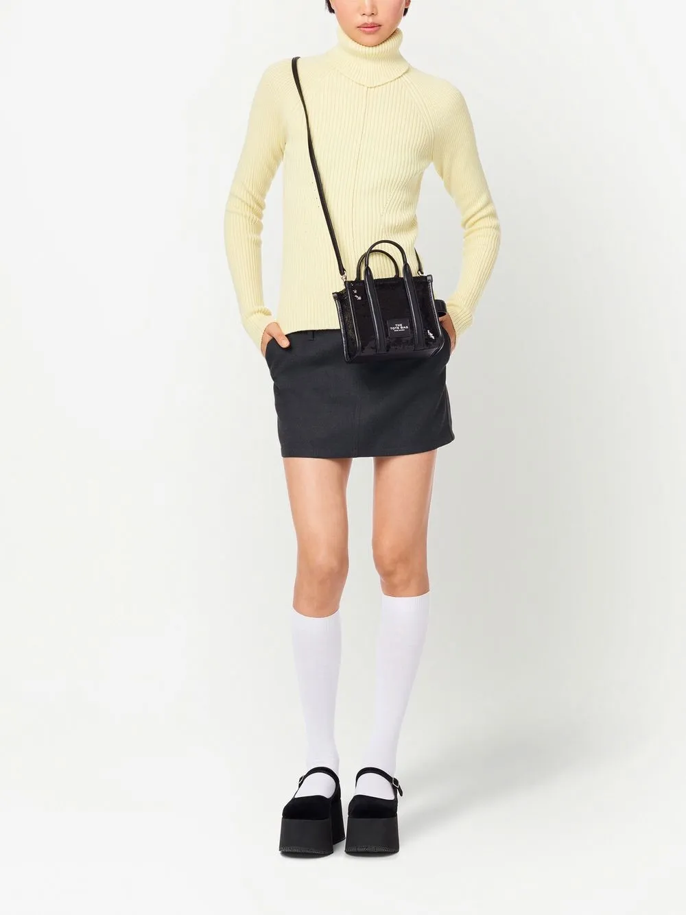 Black bag worn by a person, showing the bag fit