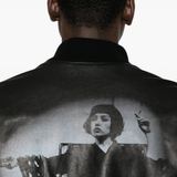 Black jacket worn by a person, showing the jacket fit