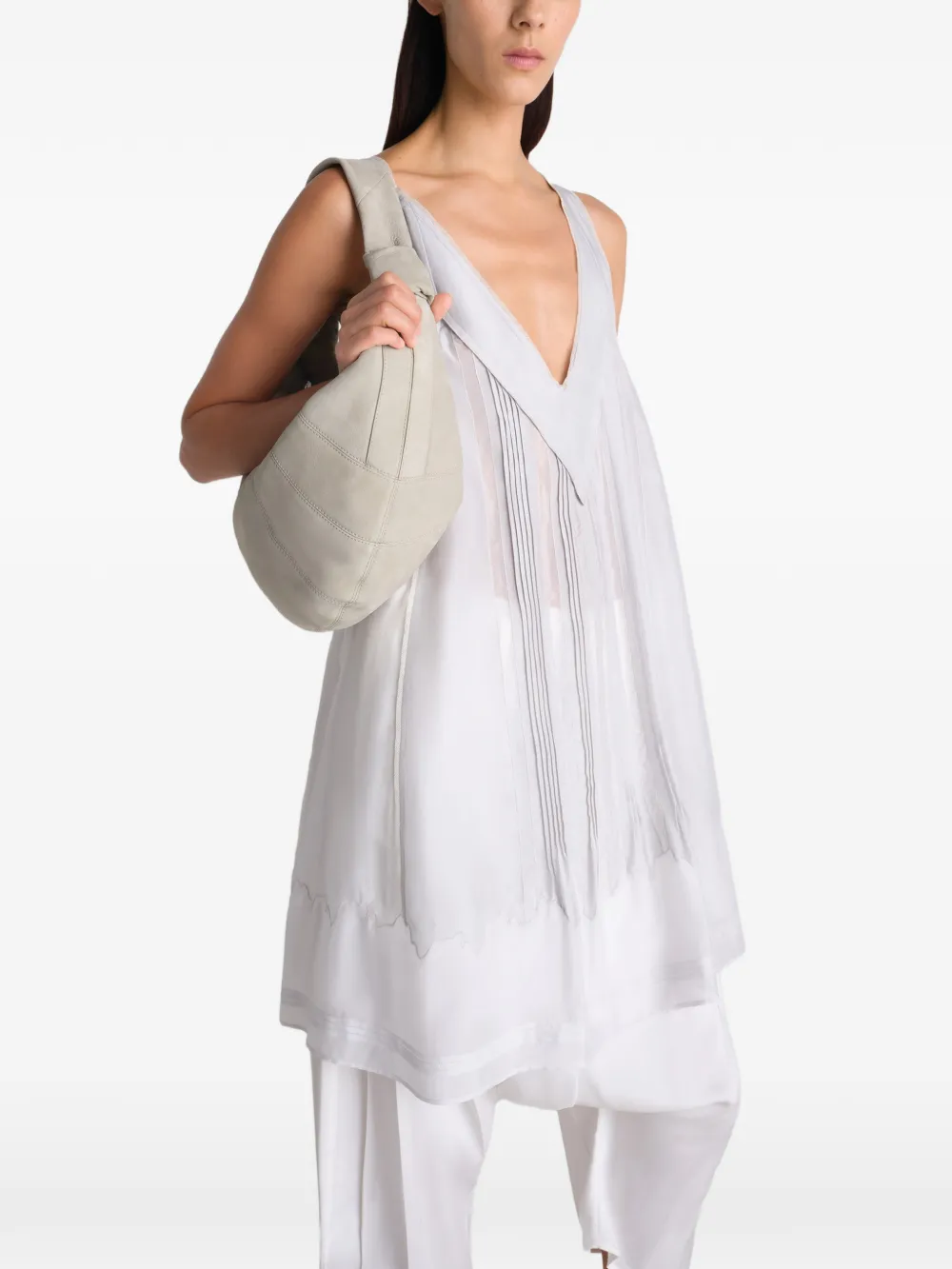 White bag worn by a person, showing the bag's fit