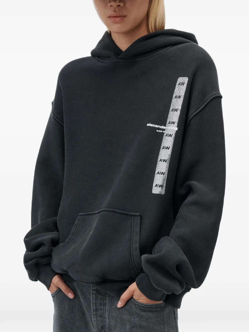Black hoodie worn by a person, showing the hoodie fit