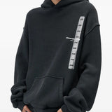 Black hoodie worn by a person, showing the hoodie fit