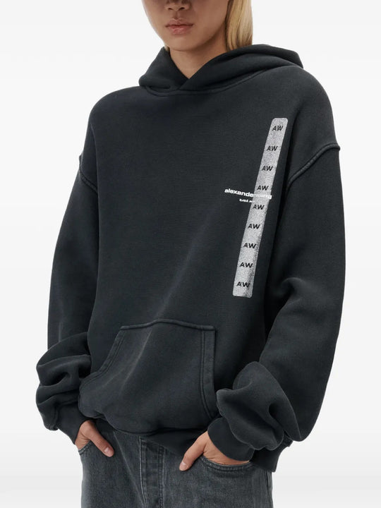 Black hoodie worn by a person, showing the hoodie fit