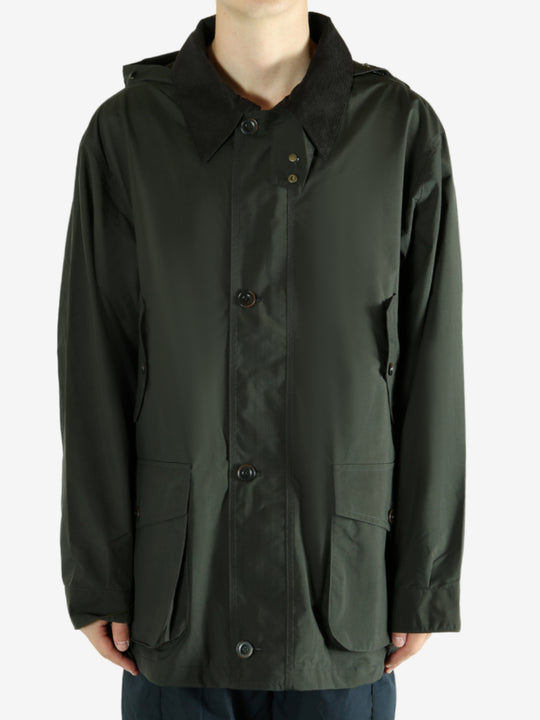 Green jacket worn by a person, showing the jacket's fit