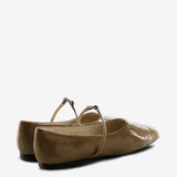 Tan flats, back view