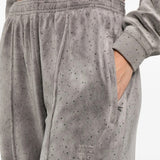 Close up of the grey pants, showing texture of the cotton fabric