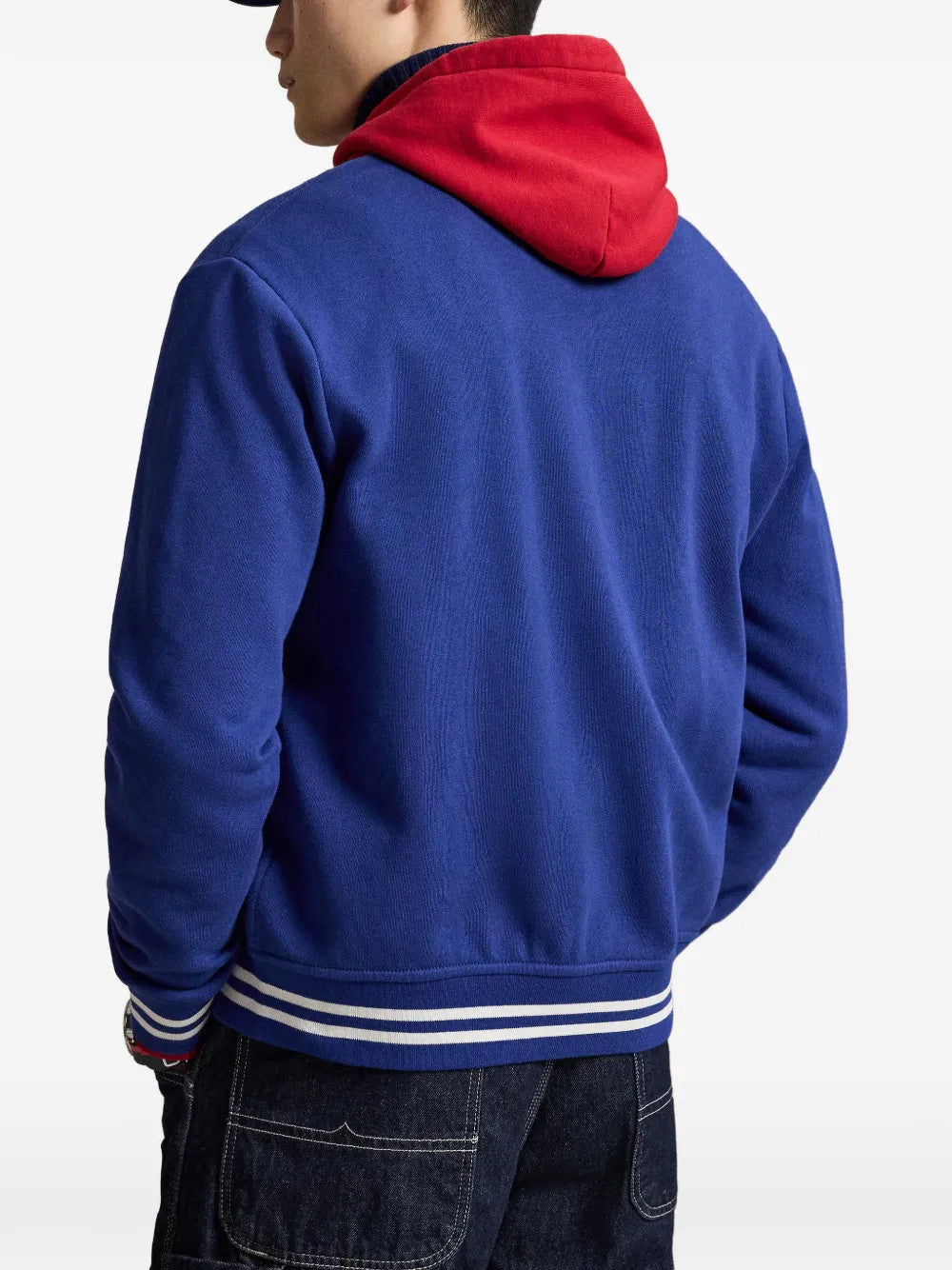 Blue jacket worn by a person, showing the jacket fit