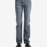 Grey pants worn by a person, showing the pants fit