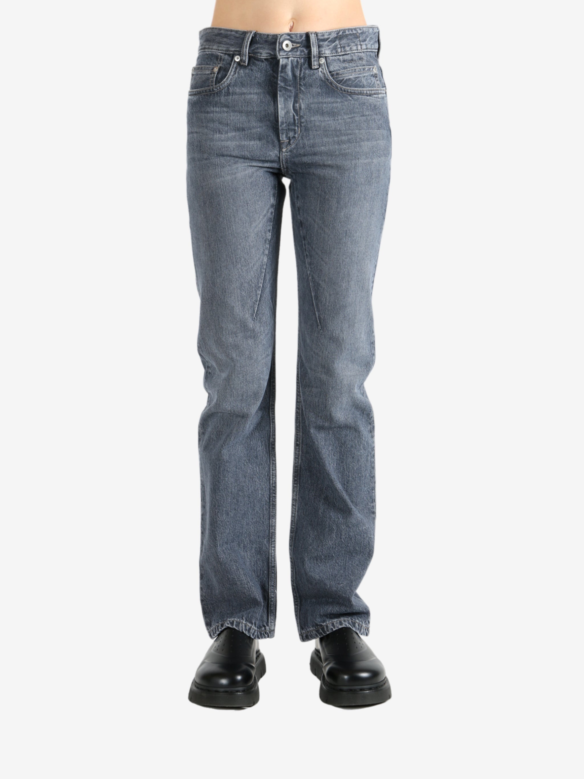 Grey pants worn by a person, showing the pants fit