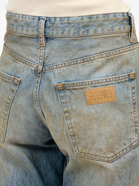 Close up of blue jeans, showing texture of the blended fabric