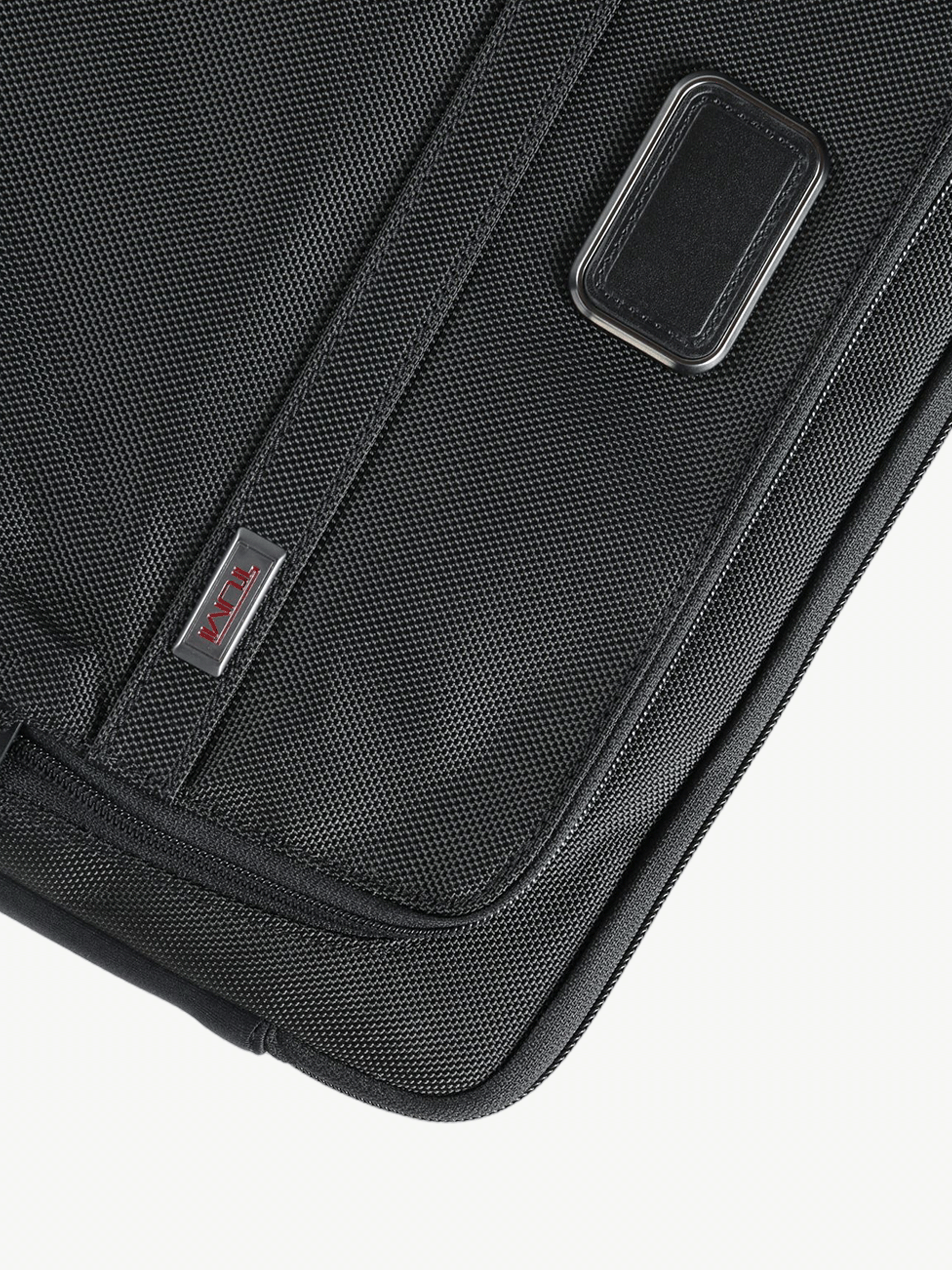 Close up of the black bag, showing texture of the nylon fabric