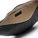 Close up of black bag, showing internal patch pocket