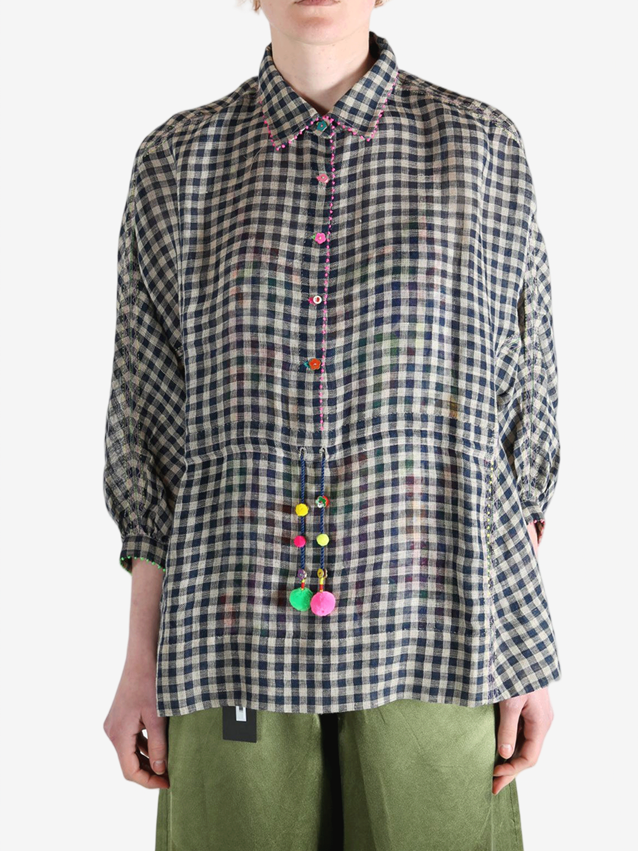 Black shirt worn by a person, showing the shirt's fit