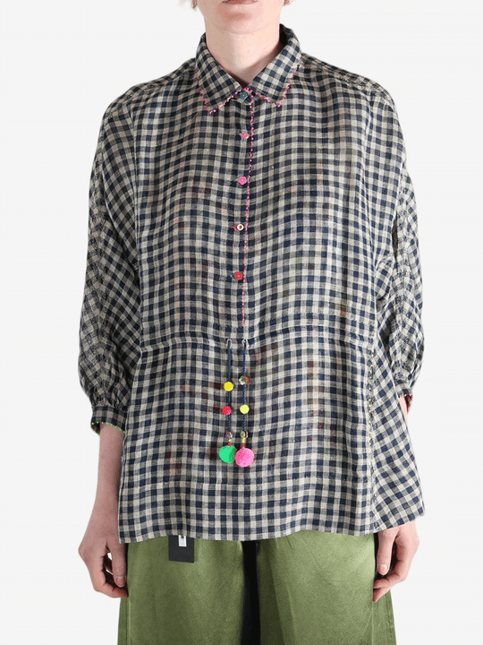 Black shirt worn by a person, showing the shirt's fit