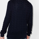 Navy pullover worn by a person, showing the pullover's fit