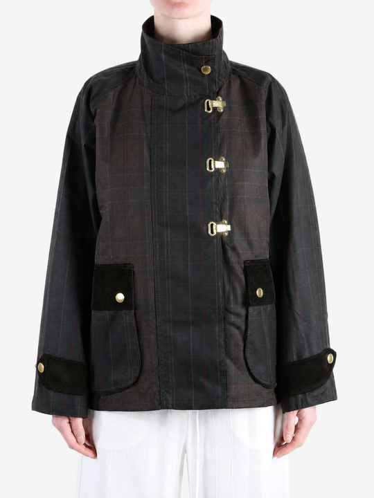 Black jacket worn by a person, showing the jacket fit