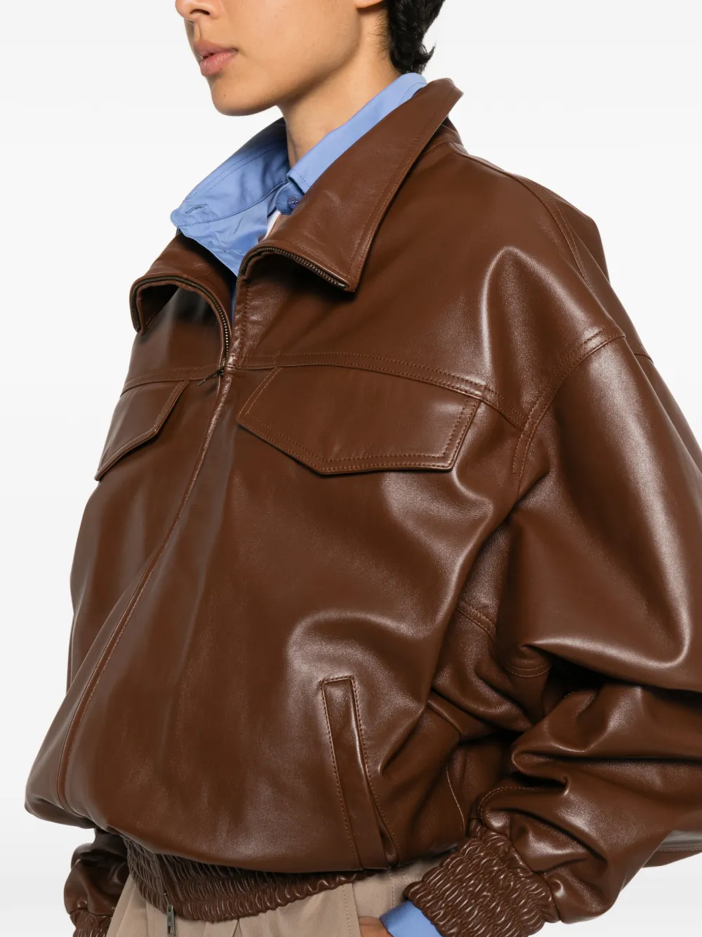 Close up of Brown jacket, showing texture of the lamb skin fabric