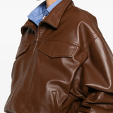Close up of Brown jacket, showing texture of the lamb skin fabric