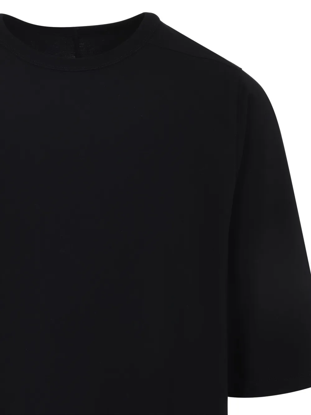 Close up of black t-shirt, showing texture of the cotton fabric