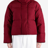 Burgundy jacket worn by a person, showing the jacket fit