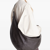 Brown bag worn by a person, showing the bag's fit