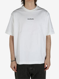 White shirt worn by a person, showing the shirt's fit