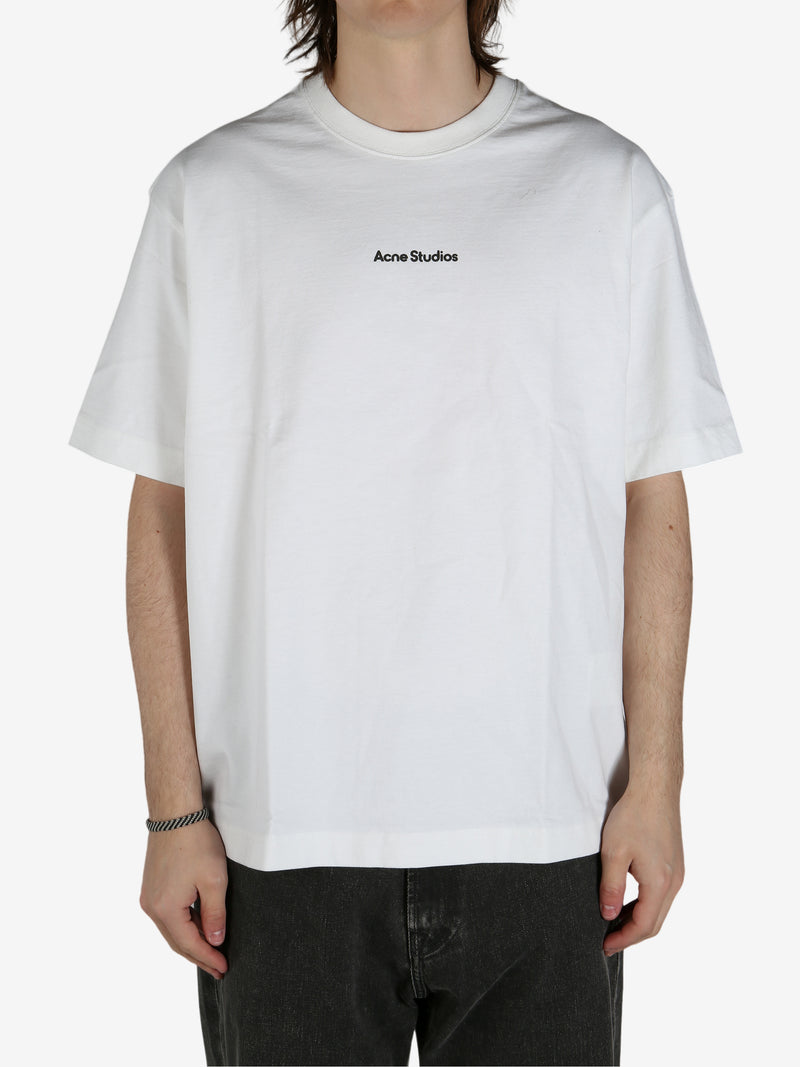 White shirt worn by a person, showing the shirt's fit