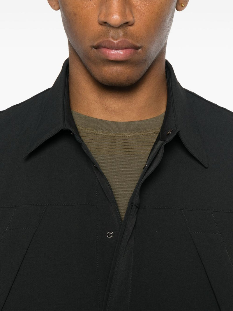 Close up of black shirts,showing texture of the polyamide and elastane fabric