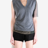 grey shirt worn by a person, showing the shirt fit