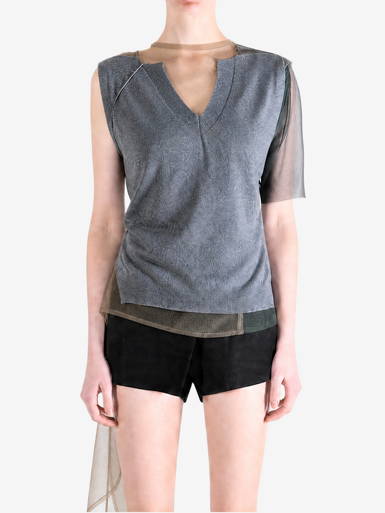 grey shirt worn by a person, showing the shirt fit