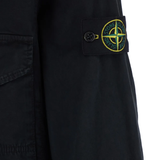 Close up of black jacketa-coats, showing texture of the polymide fabric