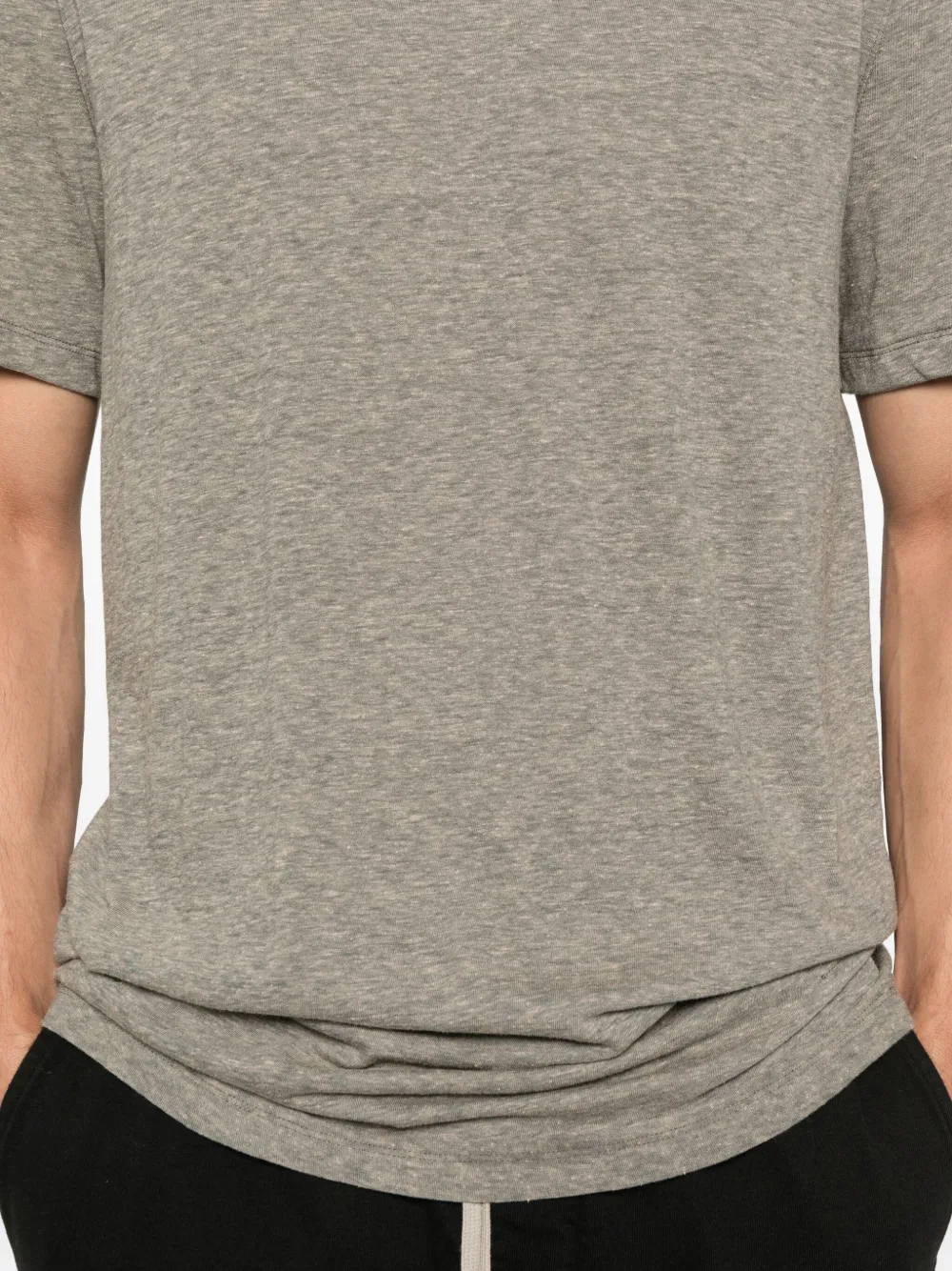 Close up of the grey t-shirt, showing texture of the cotton and polyester fabric