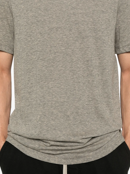 Close up of the grey t-shirt, showing texture of the cotton and polyester fabric